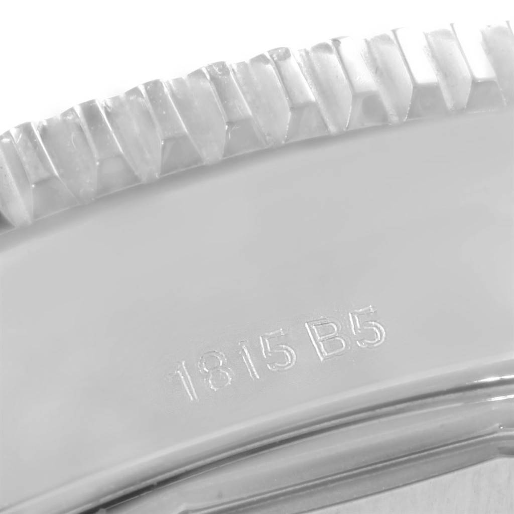 The close-up image shows part of the bezel with its ridged edge and part of the casing with the engraved model number for the Breitling Superocean A17365 Men's Stainless Steel Blue Dial A17365 Men's Stainless Steel Blue Dial watch.