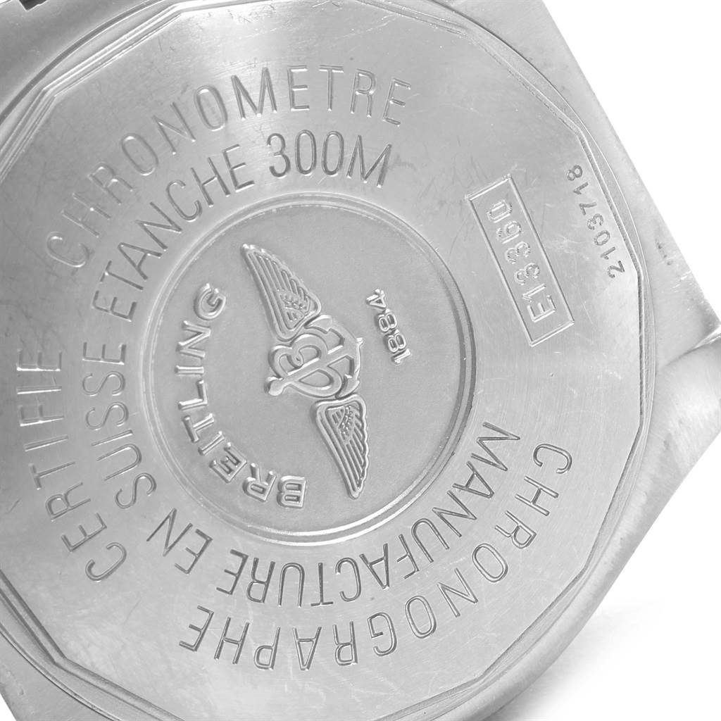 The image shows the back case of a Breitling Avenger E13360 Men's Titanium White Dial E13360 Men's Titanium White Dial watch, highlighting the engravings and emblem.