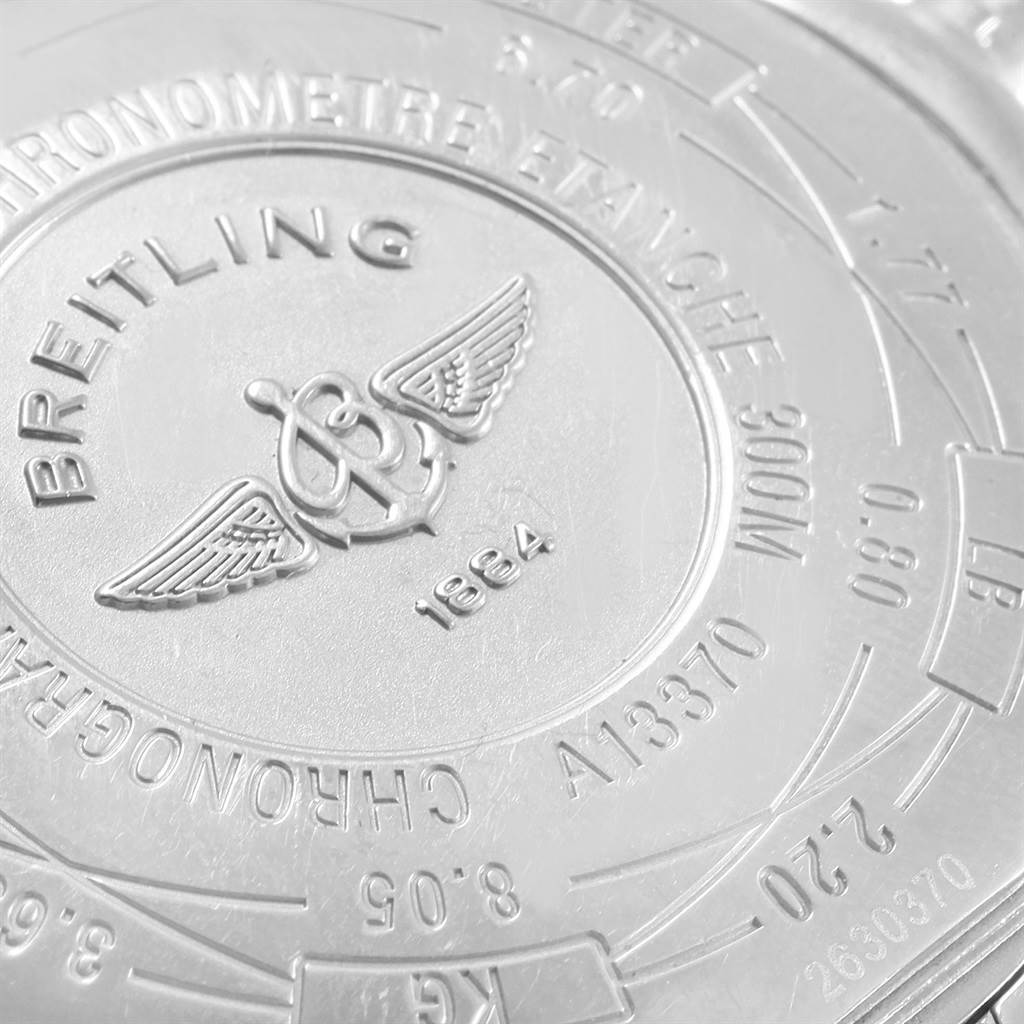 This image shows the engraved case back of a Breitling Avenger A13370 Men's Stainless Steel White Dial A13370 Men's Stainless Steel White Dial watch, showcasing details like the brand logo and model specifications.