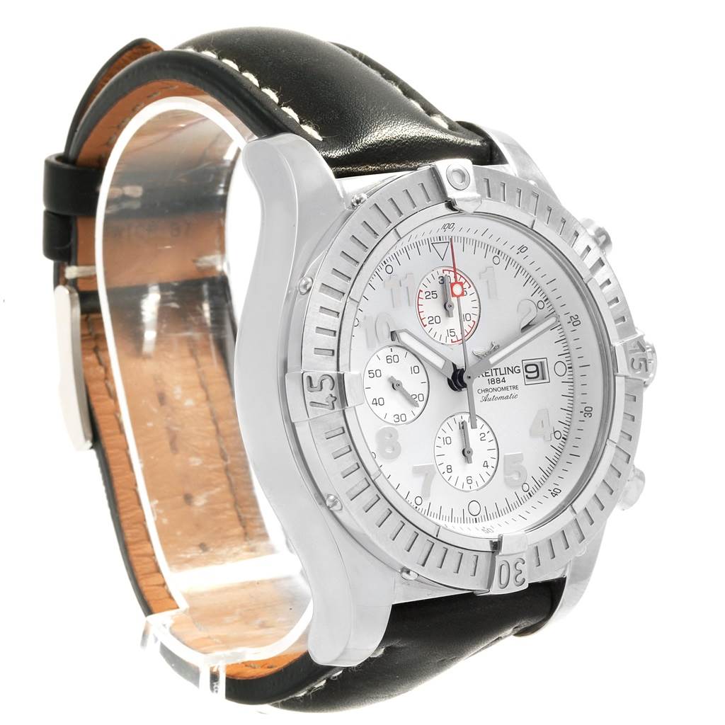 This image shows a Breitling Avenger A13370 Men's Stainless Steel White Dial A13370 Men's Stainless Steel White Dial watch angled from the front-left, highlighting its dial, bezel, and black leather strap.