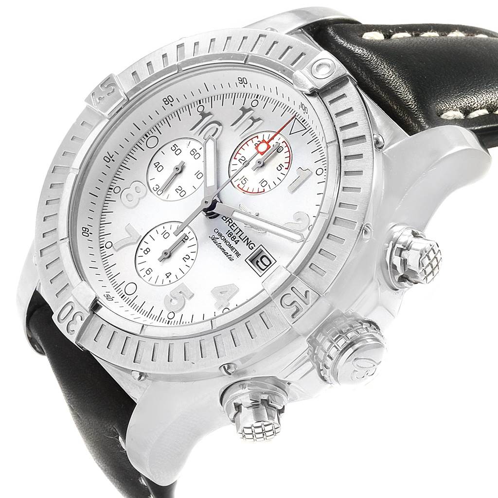 The image shows a Breitling Avenger A13370 Men's Stainless Steel White Dial A13370 Men's Stainless Steel White Dial watch at an angled view, highlighting the dial, bezel, pushers, and part of the leather strap.