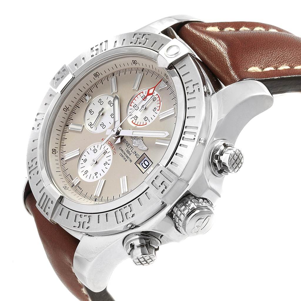 The image shows a Breitling Avenger A13371 Men's Stainless Steel Beige Dial A13371 Men's Stainless Steel Beige Dial watch from a side angle highlighting the bezel, dial, subdials, crown, and part of the leather strap.