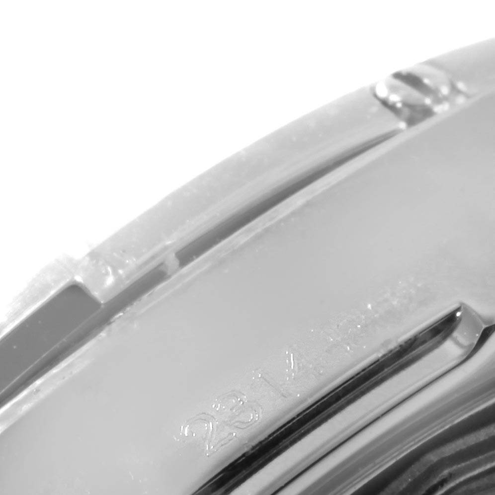 This close-up image shows the side of the bezel and part of the case of a Breitling Avenger A32390 Men's Stainless Steel Black Dial A32390 Men's Stainless Steel Black Dial watch, focusing on the engraved details.