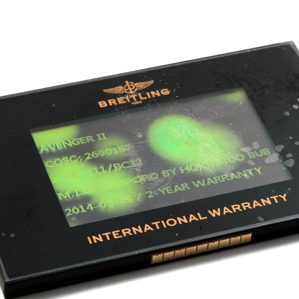 The image shows an International Warranty card for the Breitling Avenger A13381 Men's Stainless Steel Black Dial A13381 Men's Stainless Steel Black Dial II watch model.