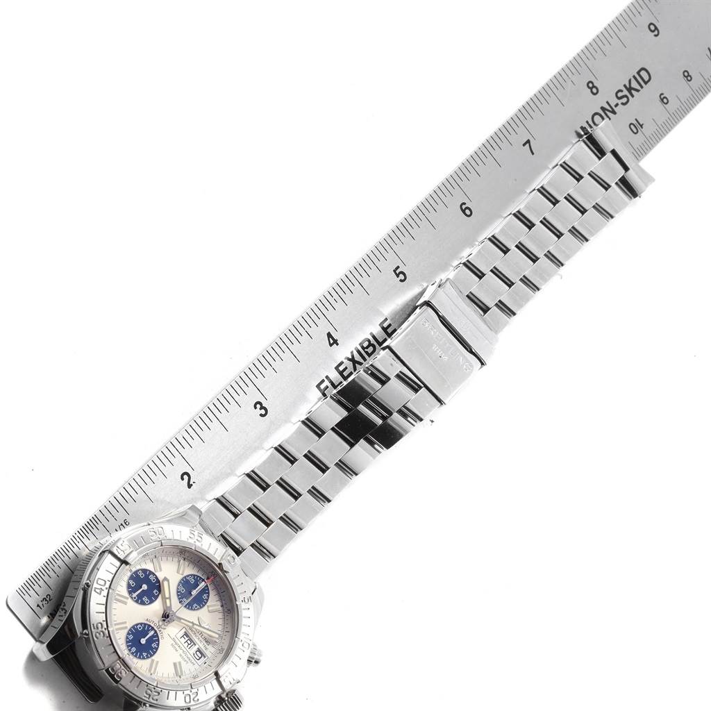 The image shows a Breitling Superocean A13340 Men's Stainless Steel Beige Dial A13340 Men's Stainless Steel Beige Dial watch laying flat with its stainless steel bracelet and a ruler for measurement.