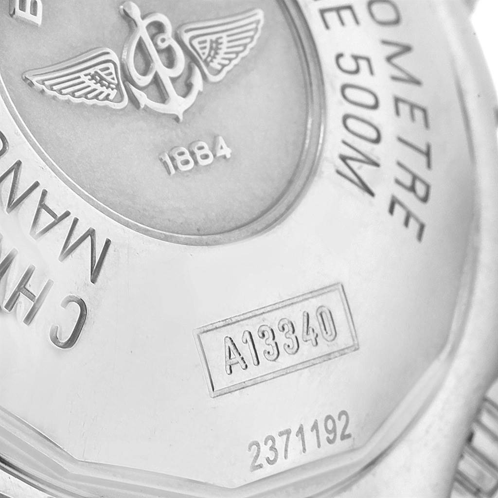 The image shows a close-up of the case back of a Breitling Superocean A13340 Men's Stainless Steel Beige Dial A13340 Men's Stainless Steel Beige Dial watch, displaying engravings and the model number.