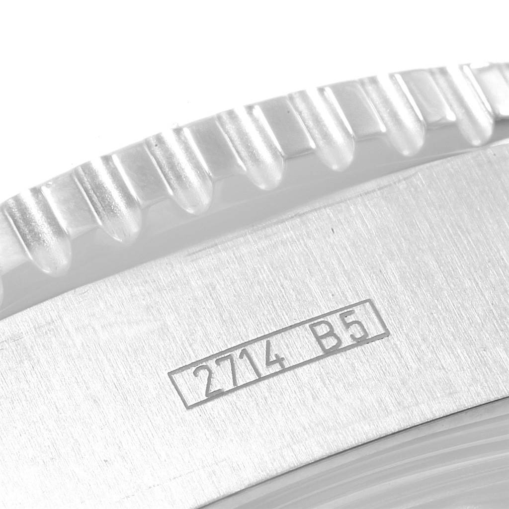 Close-up of the Breitling Superocean A13341 Men's Stainless Steel White Dial A13341 Men's Stainless Steel White Dial's watch bezel and part of the case, showing engraved markings "2714 B5".