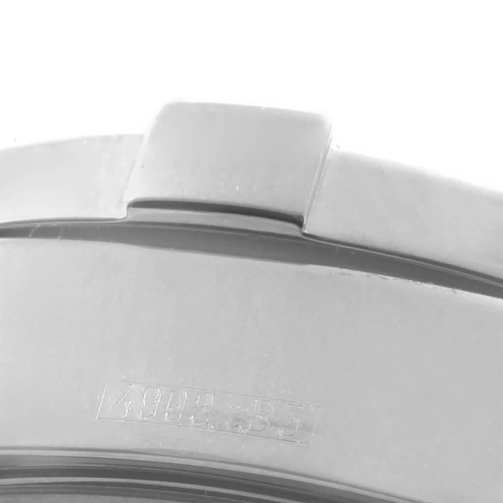 This image shows a close-up of the bracelet and part of the bezel of a Breitling Superocean A17360 Men
s Stainless Steel Yellow Dial A17360 Men
s Stainless Steel Yellow Dial watch.