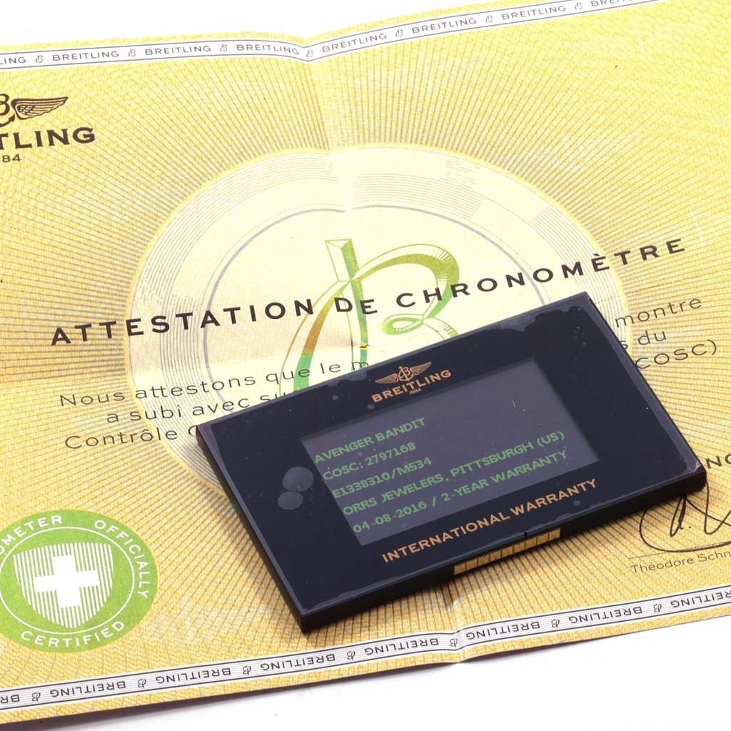 The image shows the warranty card and chronometer certification for the Breitling Avenger E13383 Men's Titanium Grey Dial E13383 Men's Titanium Grey Dial model.