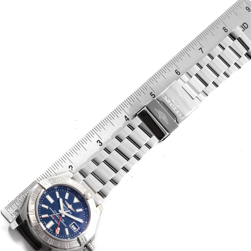 The image shows a Breitling Avenger A32390 Men's Stainless Steel Blue Dial A32390 Men's Stainless Steel Blue Dial watch with a blue dial and metal bracelet, placed alongside a ruler.