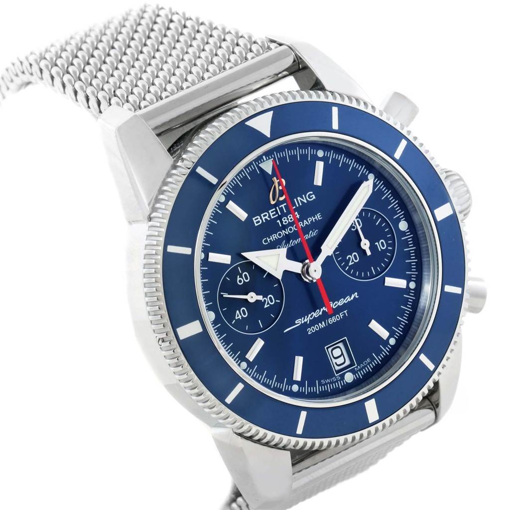 The image shows a Breitling Superocean A23370 Men
s Stainless Steel Blue Dial A23370 Men
s Stainless Steel Blue Dial watch at an oblique angle, highlighting its blue dial, bezel, chronograph subdials, and metal mesh strap.