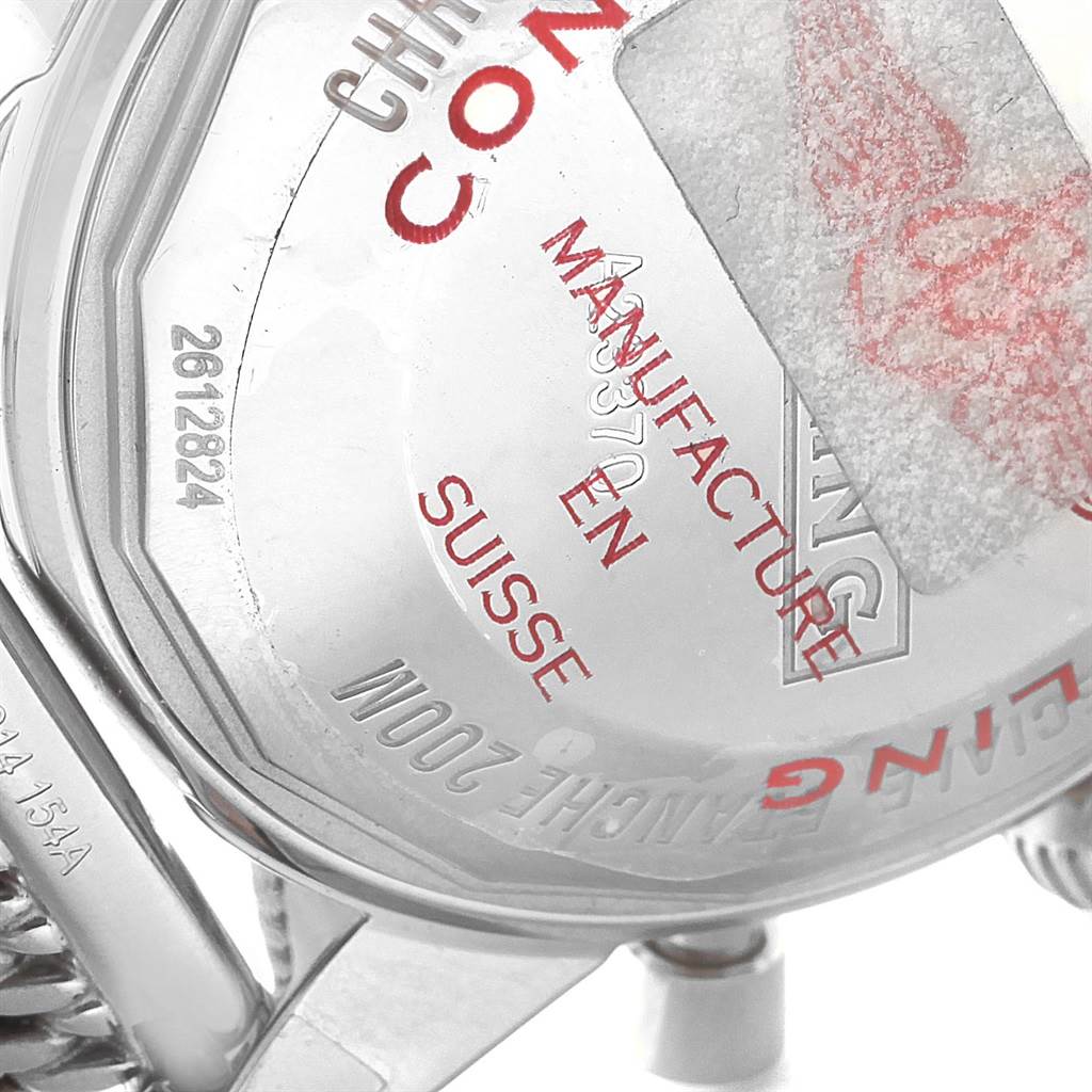 The image shows the back case of a Breitling Superocean A23370 Men
s Stainless Steel Blue Dial A23370 Men
s Stainless Steel Blue Dial watch along with part of its metal strap.