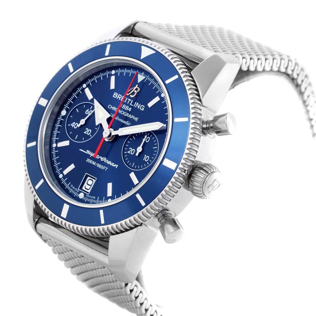 This image shows the Breitling Superocean A23370 Men
s Stainless Steel Blue Dial A23370 Men
s Stainless Steel Blue Dial watch at an angle highlighting the face, bezel, crown, pushers, and mesh bracelet.