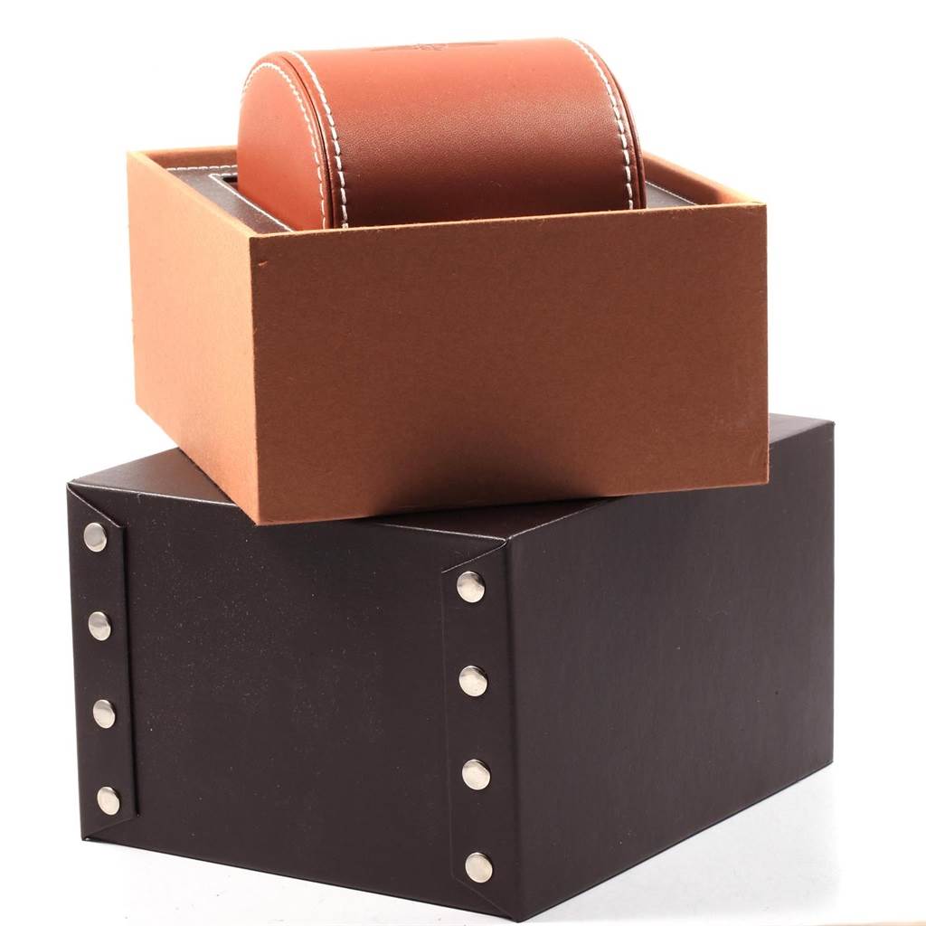 The image shows the packaging of the Breitling Superocean A23320 Men
s Stainless Steel Silver Dial A23320 Men
s Stainless Steel Silver Dial watch, including a brown box and a black studded exterior box.