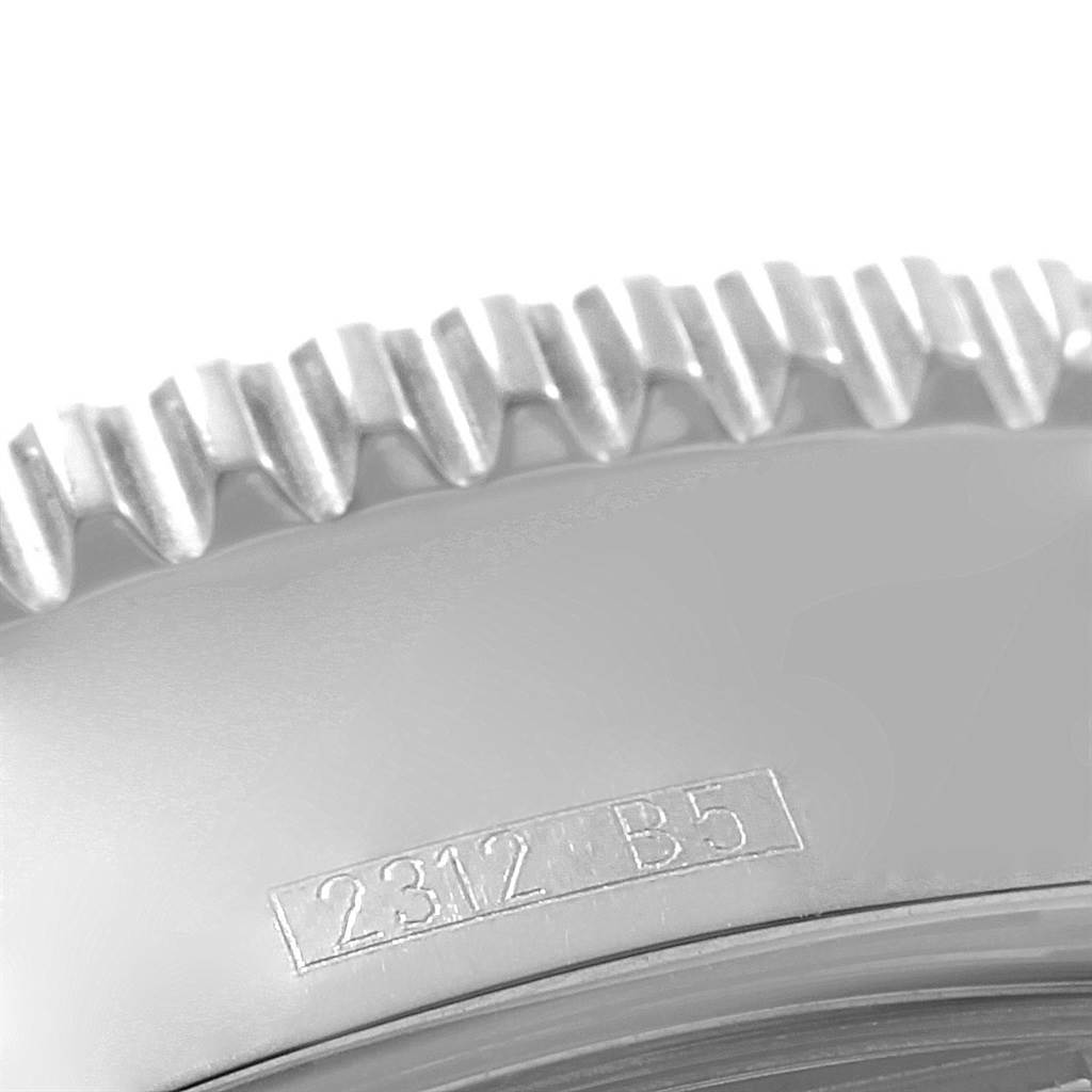 This close-up image shows the edge of the bezel and part of the case of a Breitling Superocean A17364 Men's Stainless Steel Black Dial A17364 Men's Stainless Steel Black Dial watch.