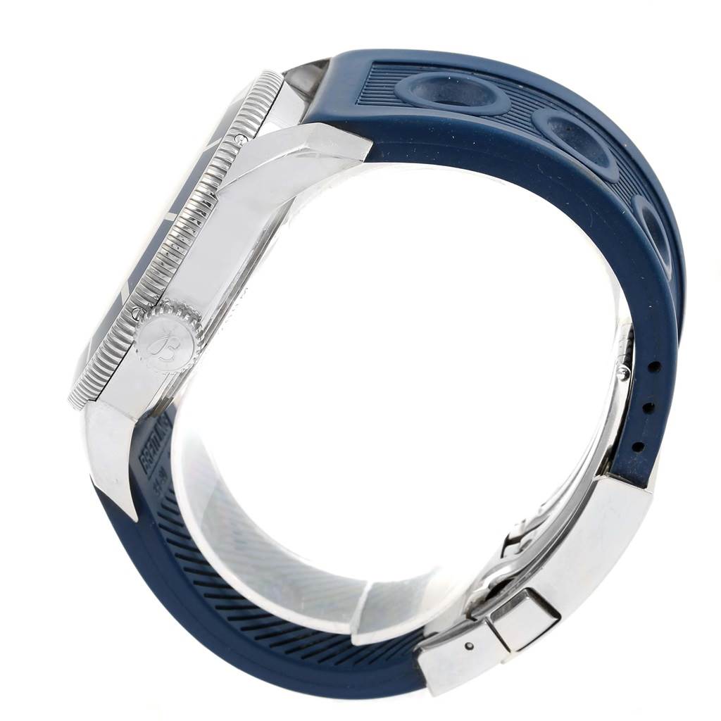 This image shows a side profile of a Breitling Superocean A17320 Men's Stainless Steel Blue Dial A17320 Men's Stainless Steel Blue Dial watch, highlighting the case, crown, and blue rubber strap with clasp.