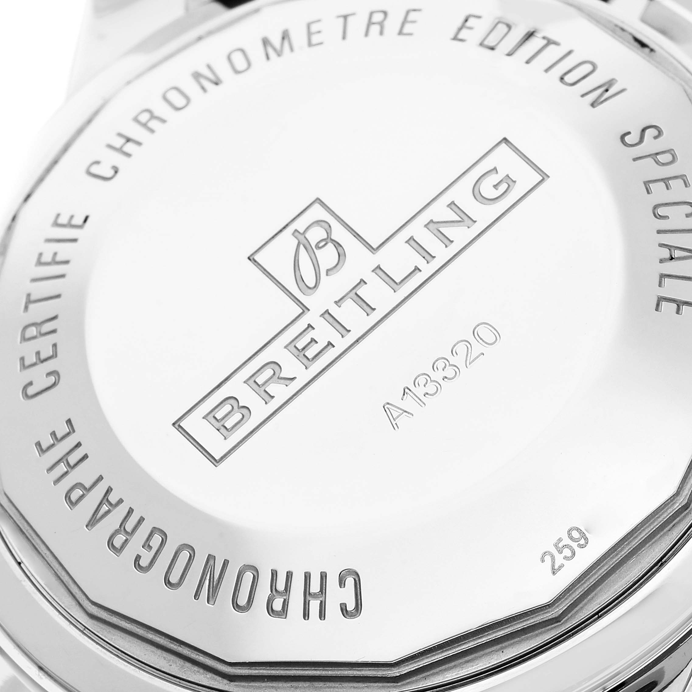 This image shows the caseback of a Breitling Superocean A13320 Men's Stainless Steel Blue Dial A13320 Men's Stainless Steel Blue Dial watch with engraving detailing its model and certifications.