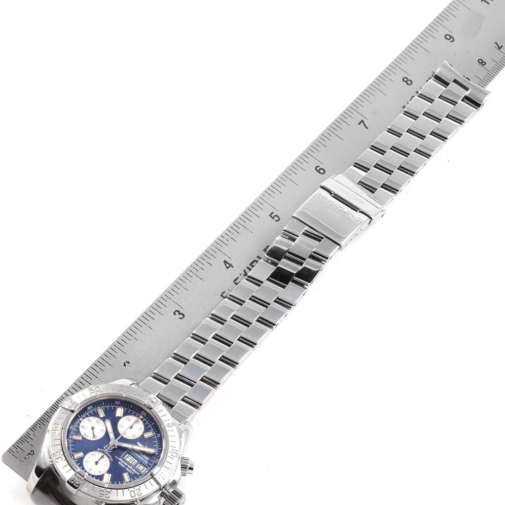 The image shows the Breitling Superocean A13340 Men's Stainless Steel Blue Dial A13340 Men's Stainless Steel Blue Dial watch laid flat with its metal bracelet and clasp displayed alongside a ruler for measurement.
