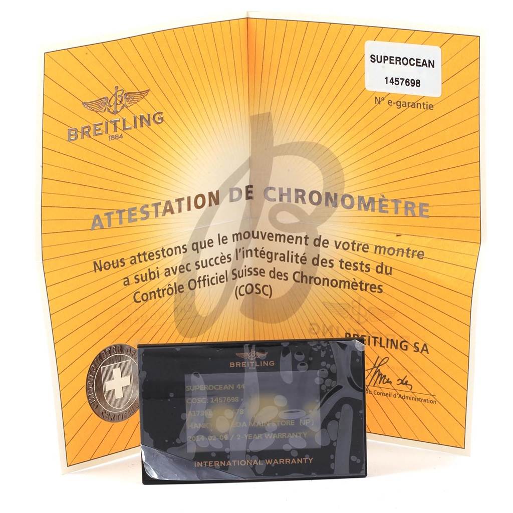 The image shows a Breitling Superocean A17391 Men's Stainless Steel Black Dial A17391 Men's Stainless Steel Black Dial model's COSC certificate and international warranty card.