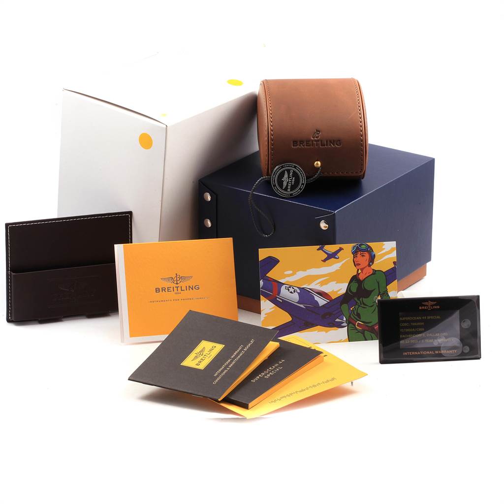 The image shows accessories for a Breitling Superocean Y1739310 Men's Stainless Steel Blue Dial Y1739310 Men's Stainless Steel Blue Dial watch, including a case, box, booklets, and warranty card.