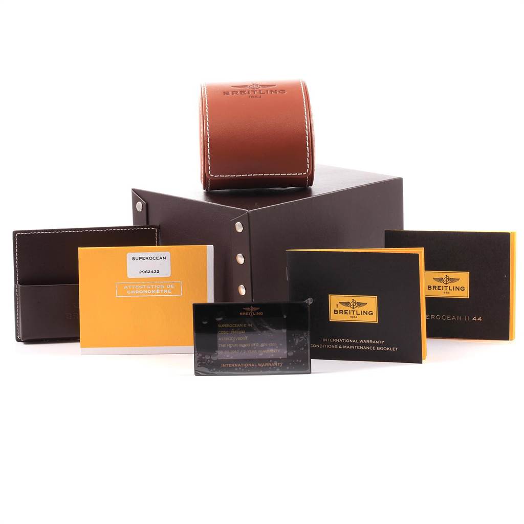 The image shows the packaging and accessories for the Breitling Superocean A17392D8/C910 Men's Stainless Steel Black Dial A17392D8/C910 Men's Stainless Steel Black Dial watch, including boxes, booklets, and a leather pouch.