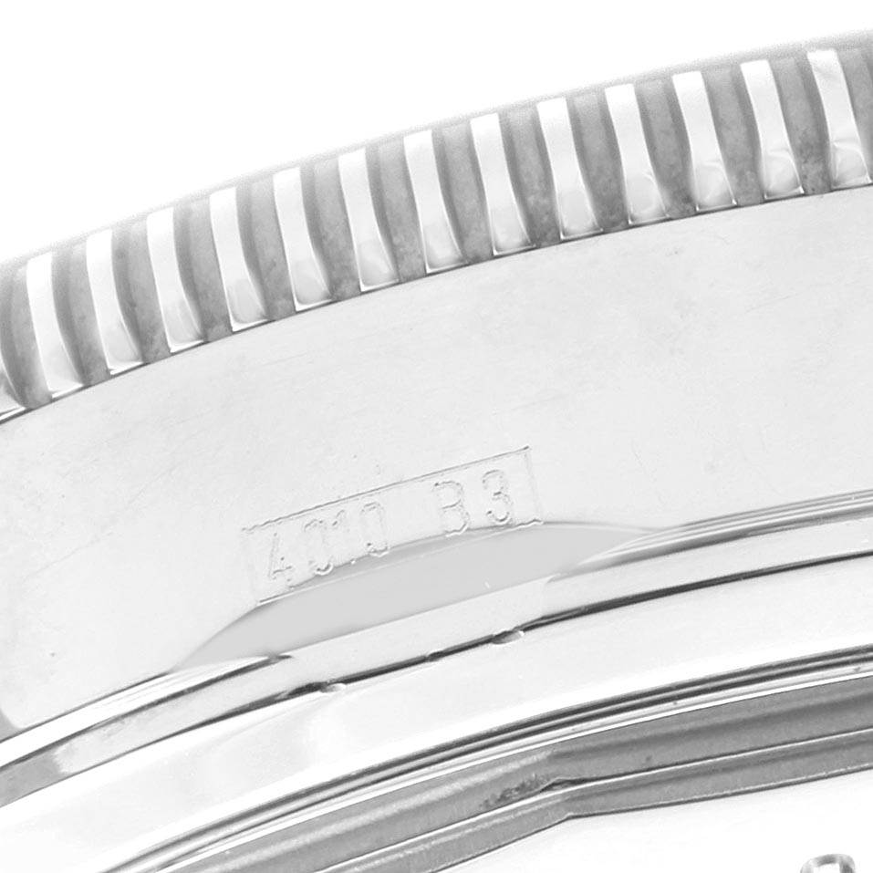 The image shows a close-up of the bezel and a portion of the case back of a Breitling Superocean A13320 Men's Stainless Steel Blue Dial A13320 Men's Stainless Steel Blue Dial watch.