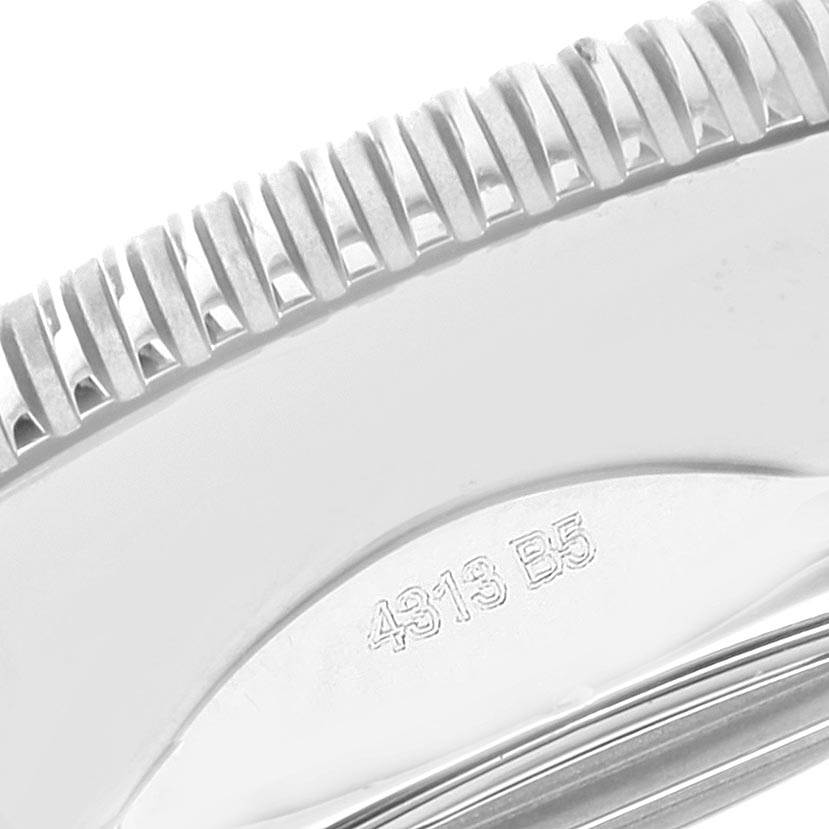 The image shows a close-up of the bezel and part of the case of a Breitling Superocean A2337 Men
s Stainless Steel Blue Dial A2337 Men
s Stainless Steel Blue Dial watch.