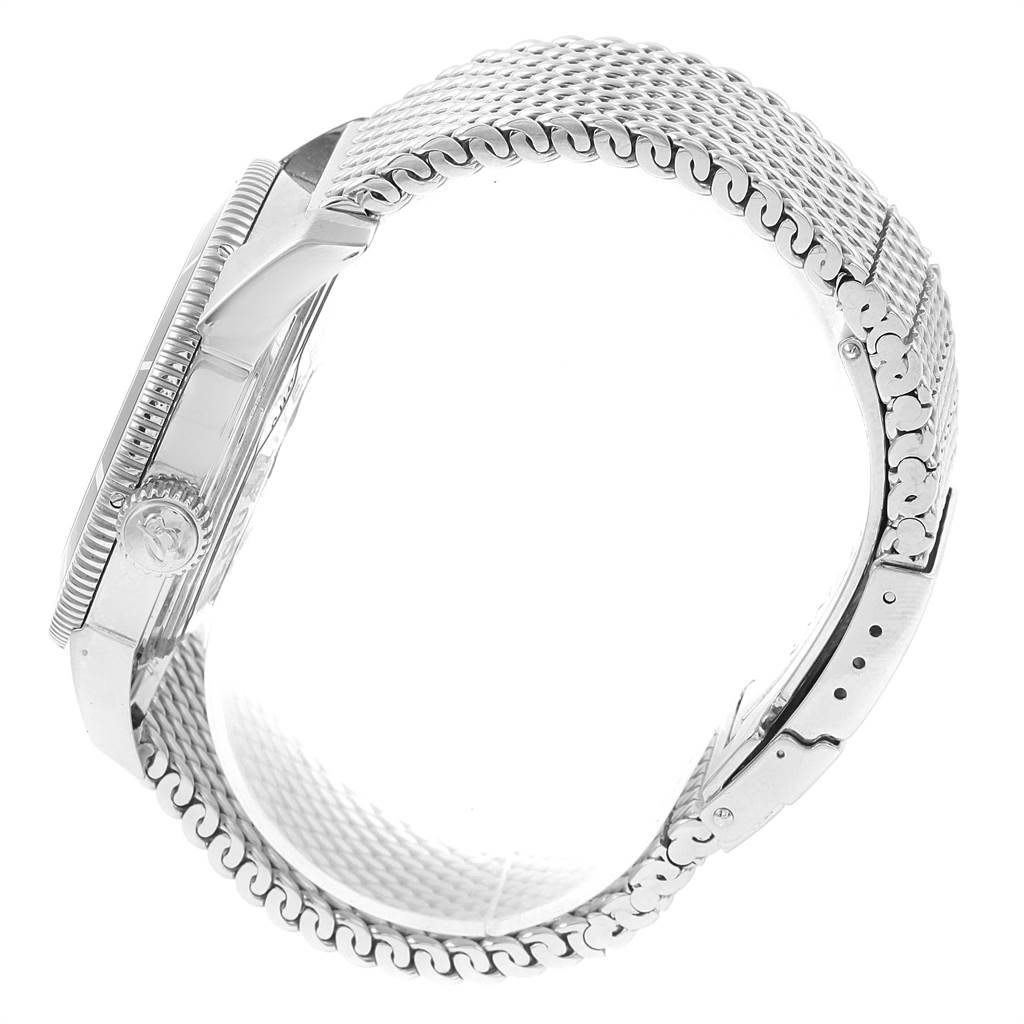 This image shows a side view of the Breitling Superocean A17321 Men's Stainless Steel Silver Dial A17321 Men's Stainless Steel Silver Dial watch, highlighting its stainless steel case, crown, and mesh bracelet.