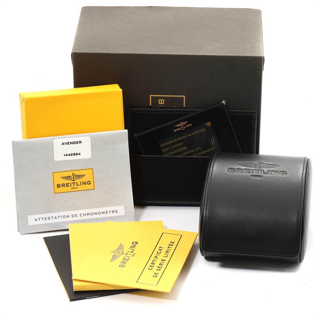 The image shows the packaging and accessories for a Breitling Avenger M17330 Men's Stainless Steel Black Dial M17330 Men's Stainless Steel Black Dial watch, including boxes, documentation, and a leather case.