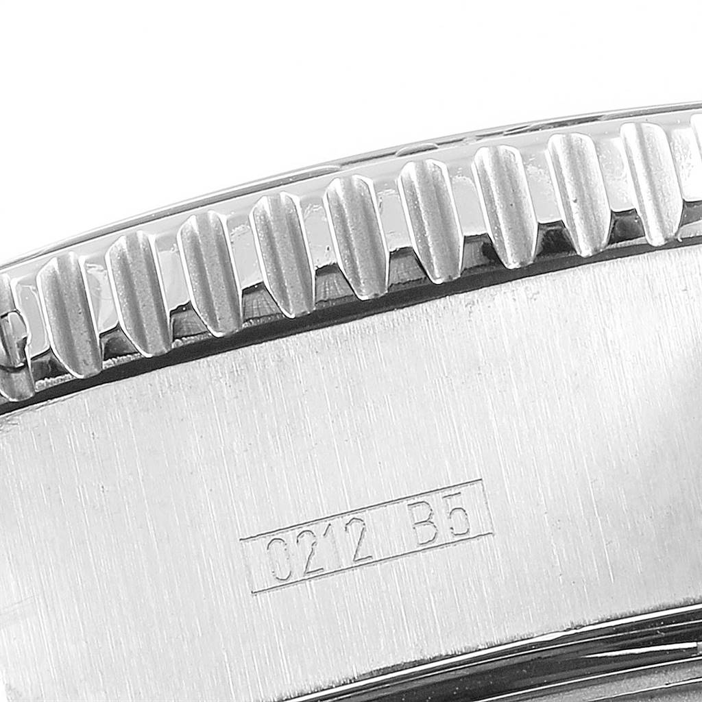 The image shows a close-up of the bezel and part of the case of a Breitling Superocean A13341 Men's Stainless Steel Black Dial A13341 Men's Stainless Steel Black Dial watch.