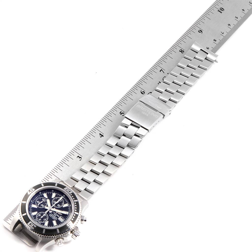 The image shows a Breitling Superocean A13341 Men's Stainless Steel Black Dial A13341 Men's Stainless Steel Black Dial watch laying flat, showcasing the dial, bezel, band, and clasp alongside a ruler for scale.