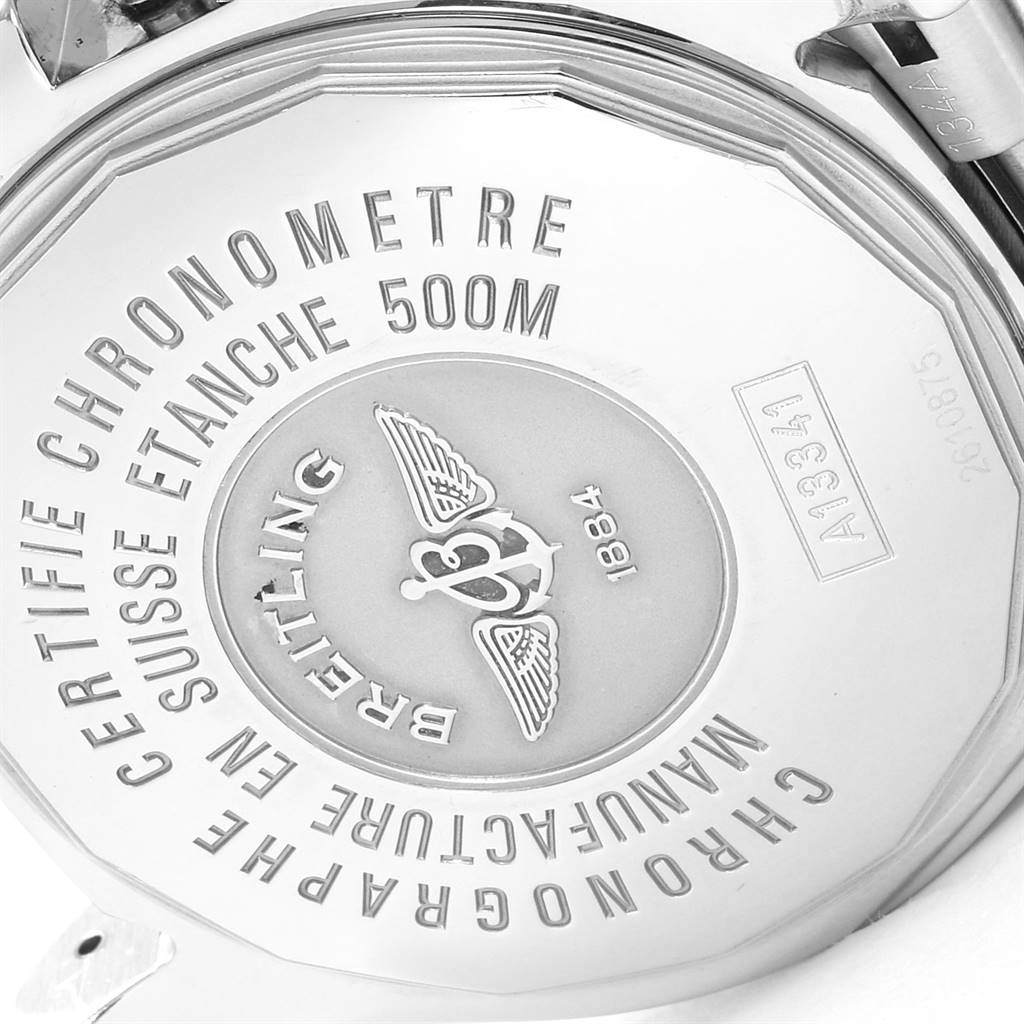 The image shows the back case of a Breitling Superocean A13341 Men's Stainless Steel Black Dial A13341 Men's Stainless Steel Black Dial watch, highlighting its engravings and certifications.