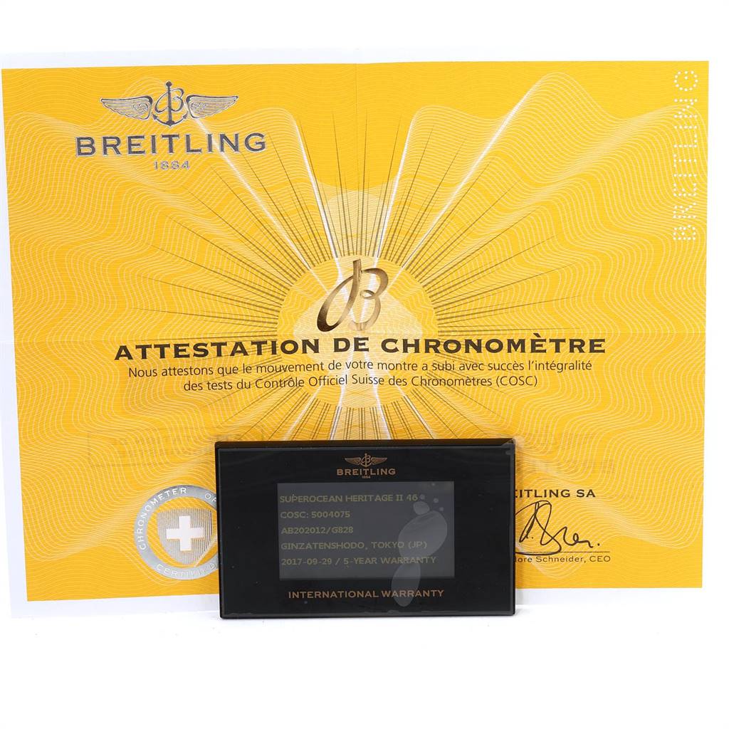 The image shows the certification and international warranty cards for a Breitling Superocean AB2020 Men's Stainless Steel Silver Dial AB2020 Men's Stainless Steel Silver Dial watch.