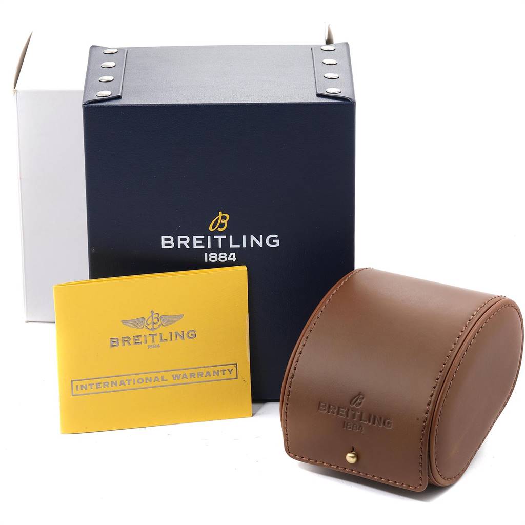 The image shows the packaging for a Breitling Avenger M13380 Men's Stainless Steel Black Dial M13380 Men's Stainless Steel Black Dial watch, including a navy blue box, a yellow warranty booklet, and a brown leather case.