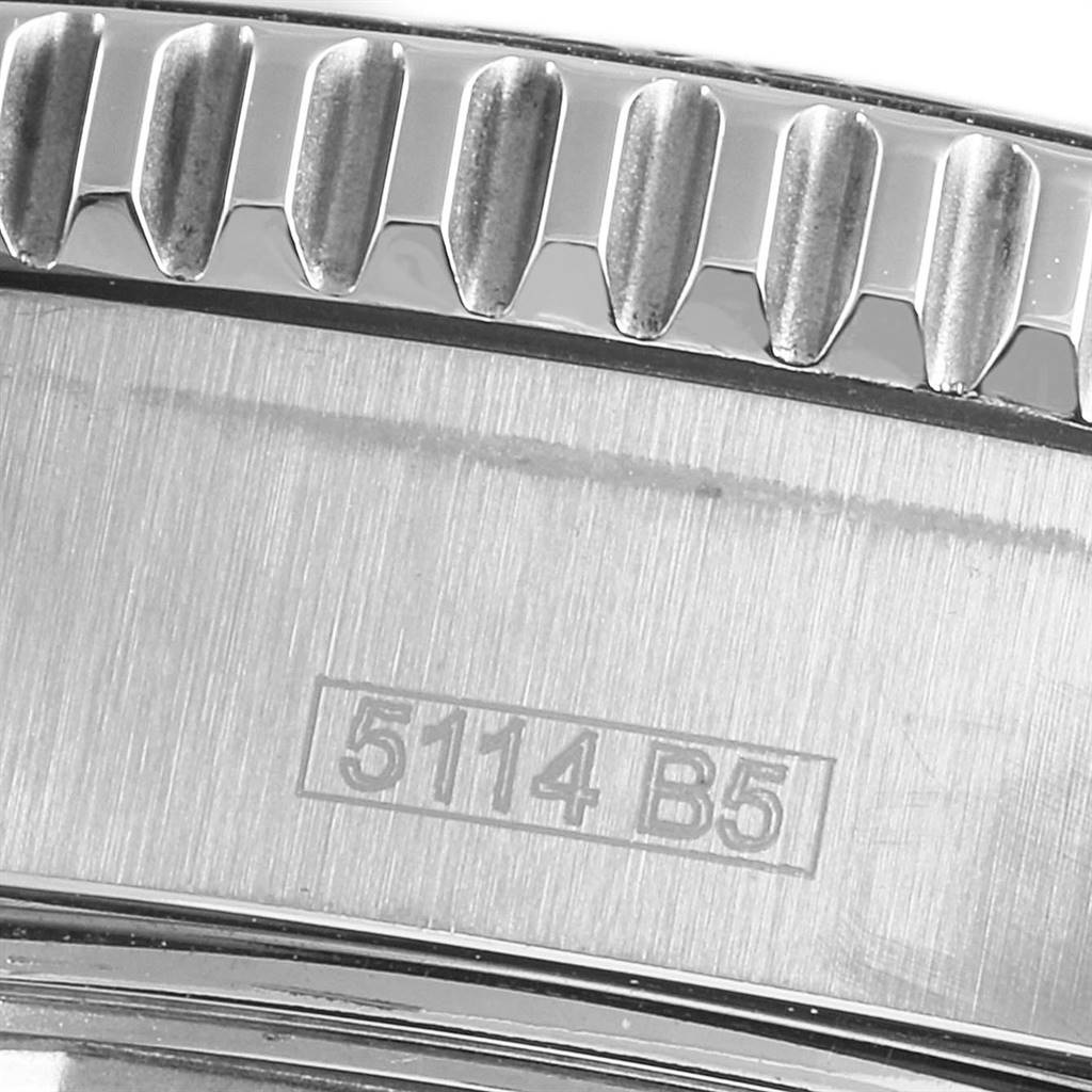 The image shows a close-up of the bezel and case side of a Breitling Superocean A17391 Men
s Stainless Steel Black Dial A17391 Men
s Stainless Steel Black Dial watch, including some engraved markings.