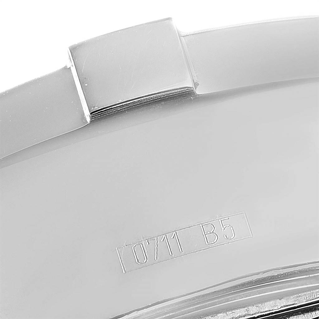 This close-up image shows the metal bracelet link and stamped serial number "0711 B5" of the Breitling Superocean A13340 Men's Stainless Steel Beige Dial A13340 Men's Stainless Steel Beige Dial watch.