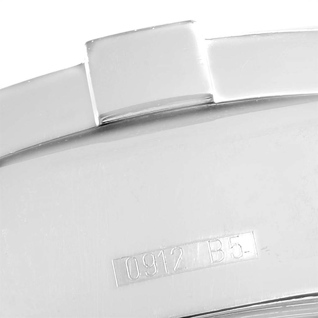 This close-up image of the Breitling Superocean A13340 Men
s Stainless Steel Black Dial A13340 Men
s Stainless Steel Black Dial watch shows part of the clasp and a serial number.