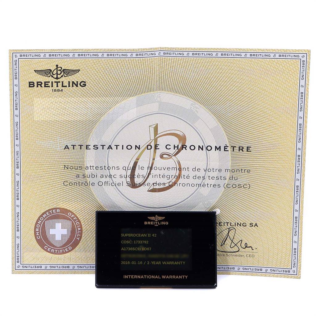 This image shows the Breitling Superocean A17391 Men
s Stainless Steel Black Dial A17391 Men
s Stainless Steel Black Dial II 42 model
s attestation of chronometer and international warranty card.