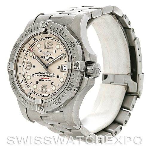 The image shows a side angle of the Breitling Superocean A17390 Men's Stainless Steel Silver Dial A17390 Men's Stainless Steel Silver Dial watch, highlighting the face, bezel, and metal bracelet.