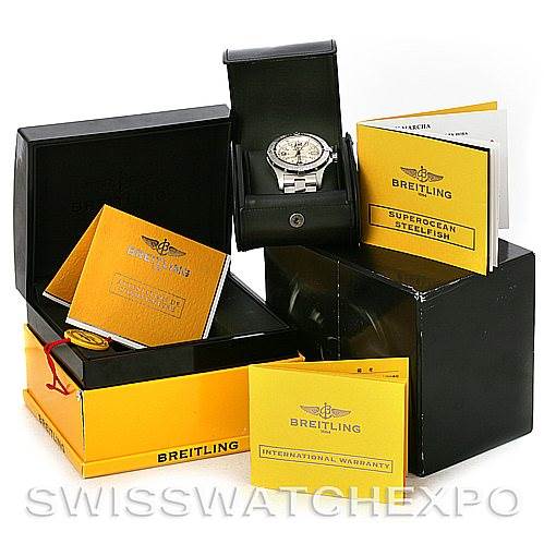 The image shows a Breitling Superocean A17390 Men's Stainless Steel Silver Dial A17390 Men's Stainless Steel Silver Dial watch, viewing it from the top, along with its box, papers, and accessories.
