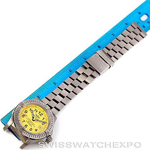 The Breitling Avenger E17370 Men's Titanium Yellow Dial E17370 Men's Titanium Yellow Dial watch is shown from a top-down angle, displaying the dial, bezel, case, and full bracelet.