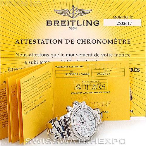 The image shows a Breitling Avenger A13370 Men's Stainless Steel White Dial A13370 Men's Stainless Steel White Dial watch from a front angle, along with warranty papers and a certificate of authenticity.