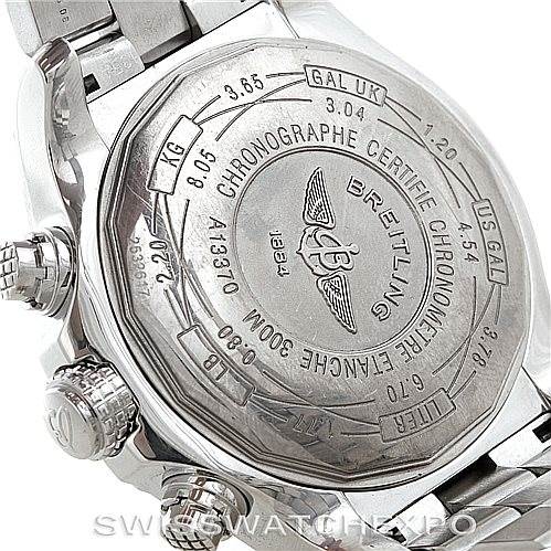 The image shows the back case and part of the bracelet of a Breitling Avenger A13370 Men's Stainless Steel White Dial A13370 Men's Stainless Steel White Dial watch, highlighting its engravings and certification details.