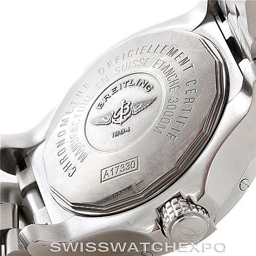 The image shows the back case and crown of a Breitling Avenger A17330 Men's Stainless Steel Yellow Dial A17330 Men's Stainless Steel Yellow Dial watch, highlighting the engravings and stainless steel bracelet.