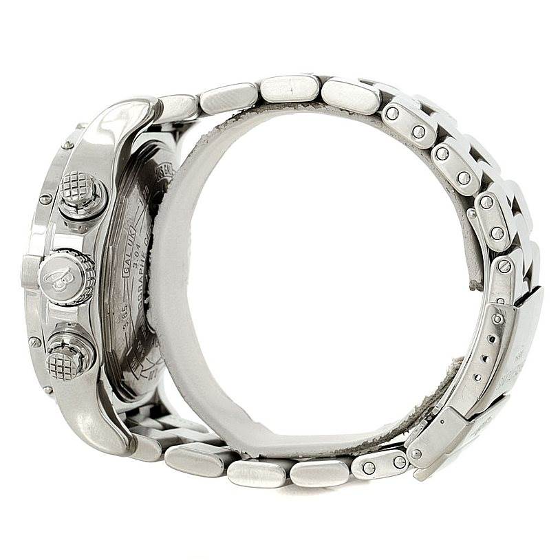 This side view of the Breitling Avenger A13370 Men's Stainless Steel White Dial A13370 Men's Stainless Steel White Dial watch shows the case, crown, pushers, and part of the metal bracelet and clasp.