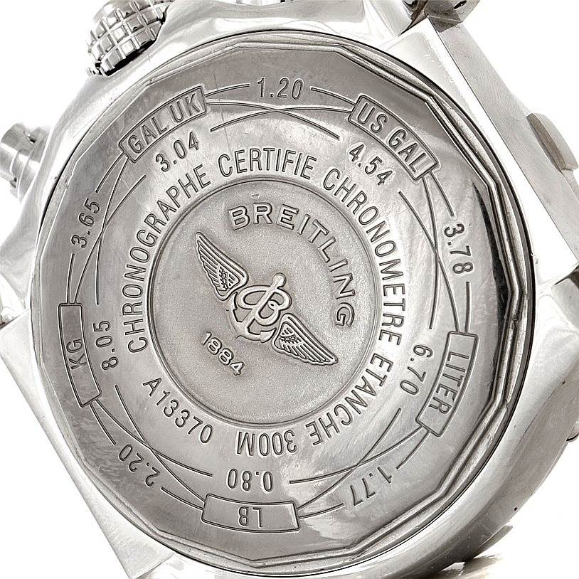 The image shows the back case of a Breitling Avenger A13370 Men's Stainless Steel White Dial A13370 Men's Stainless Steel White Dial watch, featuring engravings and measurement conversions.