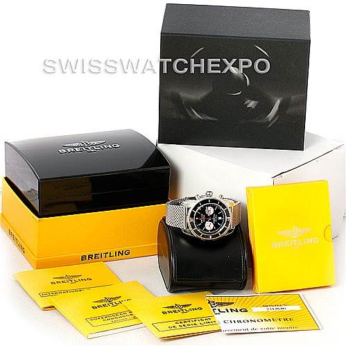 The image shows a Breitling Superocean A23320 Men's Stainless Steel Black Dial A23320 Men's Stainless Steel Black Dial watch at an angle with its case, manuals, and original packaging.