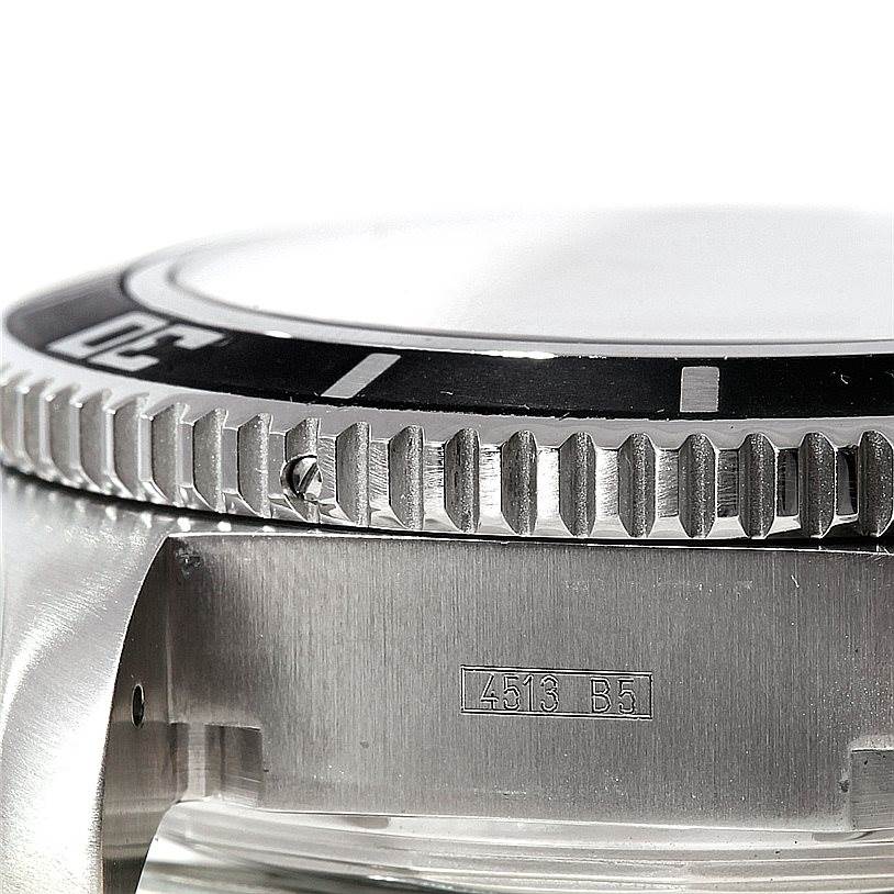 The image shows a close-up of the bezel and case of a Breitling Superocean A13341 Men's Stainless Steel Black Dial A13341 Men's Stainless Steel Black Dial watch with a visible serial number.