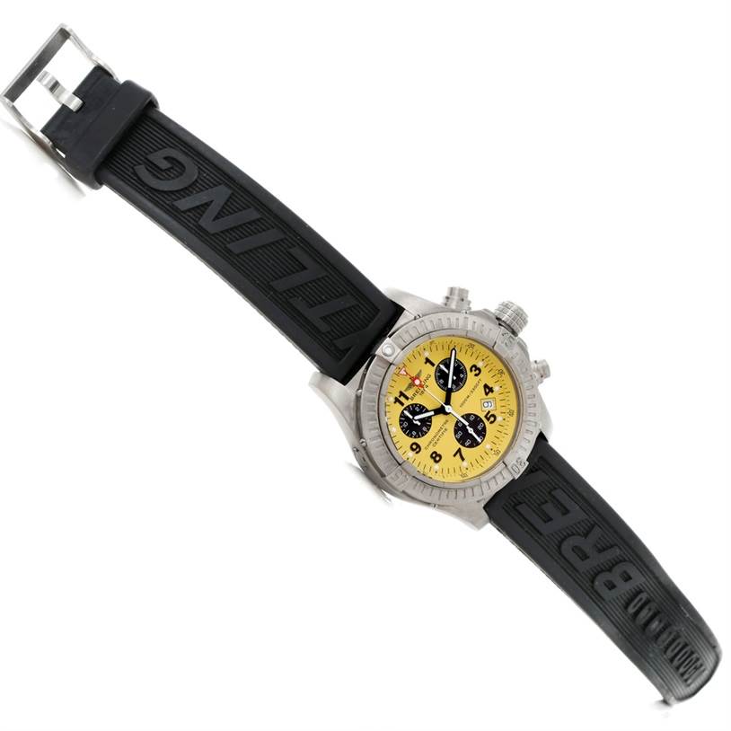 The Breitling Avenger E73360 Men's Titanium Yellow Dial E73360 Men's Titanium Yellow Dial watch is shown at an angled view, highlighting the yellow dial, black rubber strap, and stainless steel case.