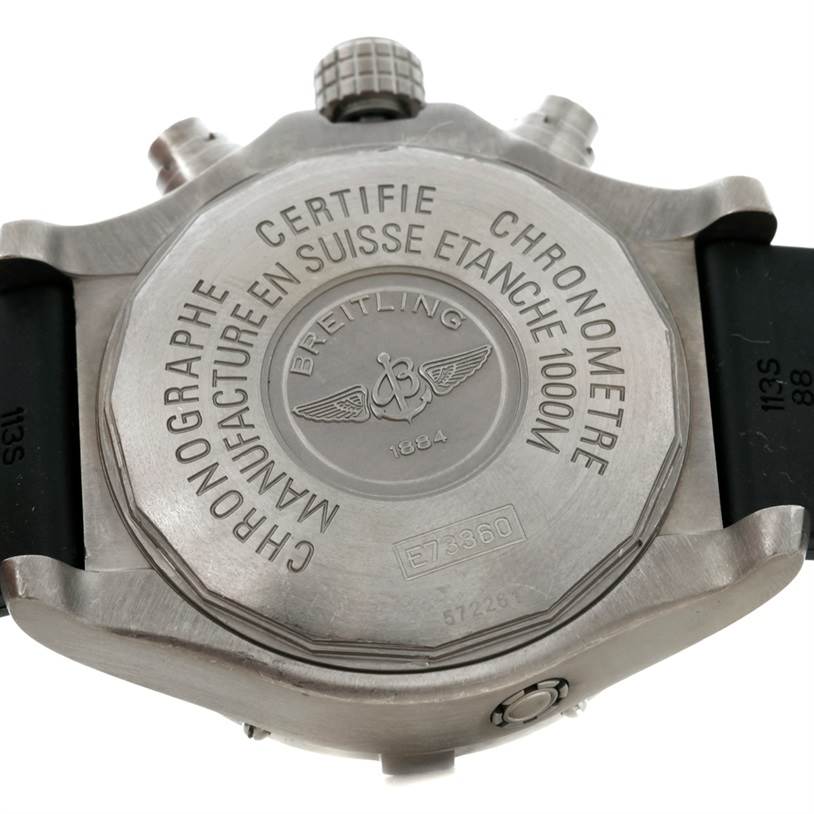 The image shows the back casing of a Breitling Avenger E73360 Men's Titanium Yellow Dial E73360 Men's Titanium Yellow Dial watch, highlighting the engraved model details and specifications.